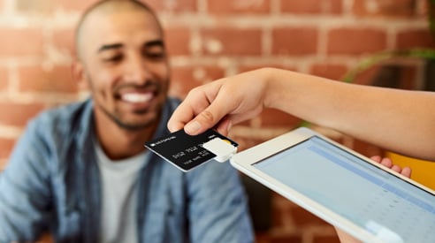 A man paying for service with card